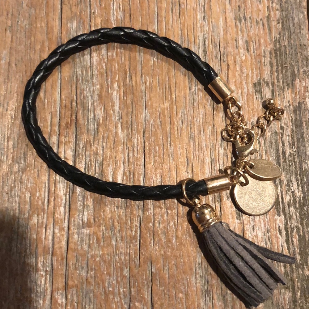 Black and gold tassel bracelet.